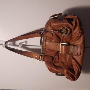 Michael kors hand bag. 14 in long. Color brown